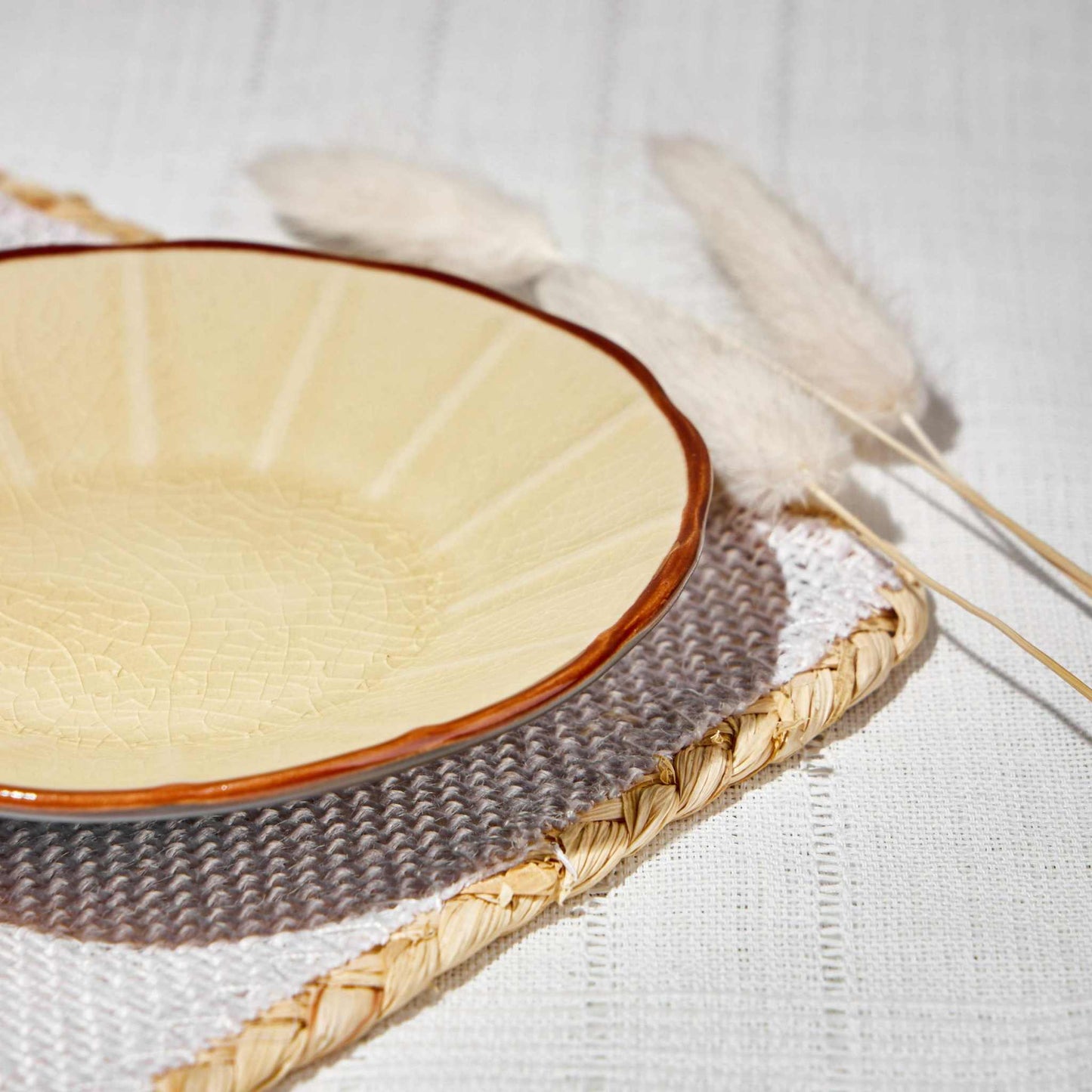 ACEM CERAMIC TEA PLATE- CARAMELElevate your tea-time experience with the ACEM Ceramic Tea Plate in a warm caramel hue. This elegant plate features a minimalist sunburst design with a textured centCeramic Plate