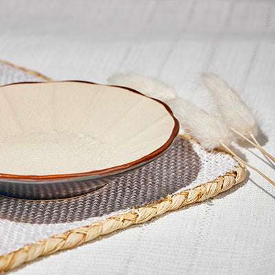 ACEM CERAMIC TEA PLATEElevate your tea-time experience with the ACEM Ceramic Tea Plate in a warm caramel hue. This elegant plate features a minimalist sunburst design with a textured centCeramic Plate
