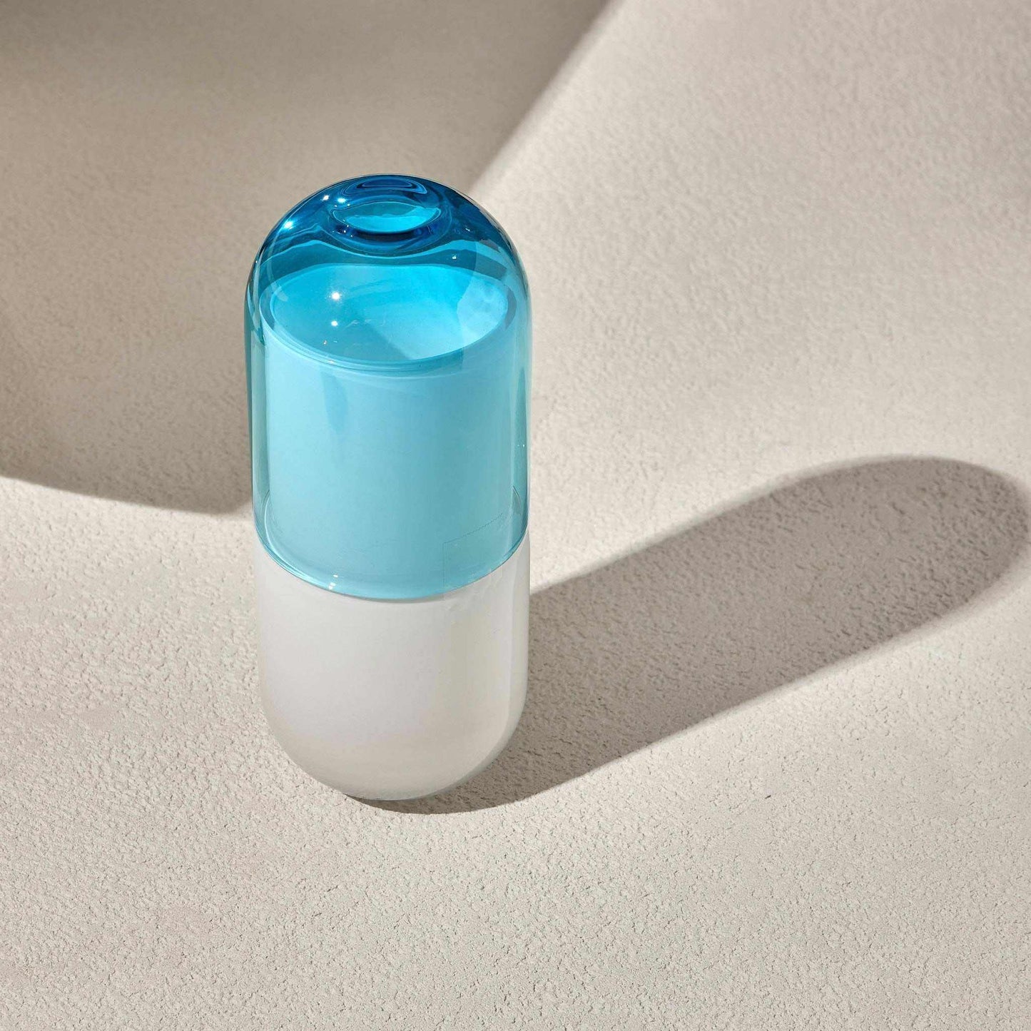 WATER NIGHT SET - TURQUOISEStay hydrated in style with this sleek and functional water night set, perfect for your bedside table. The set includes a minimalist carafe and a matching glass, desServing Pitchers
