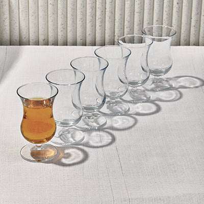 SOCKET THE GLASSElevate your beverage experience with the elegant Socket Glass Set. This collection features gracefully curved glasses, perfect for serving tea, cocktails, or other Glass