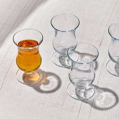 SOCKET THE GLASSElevate your beverage experience with the elegant Socket Glass Set. This collection features gracefully curved glasses, perfect for serving tea, cocktails, or other Glass