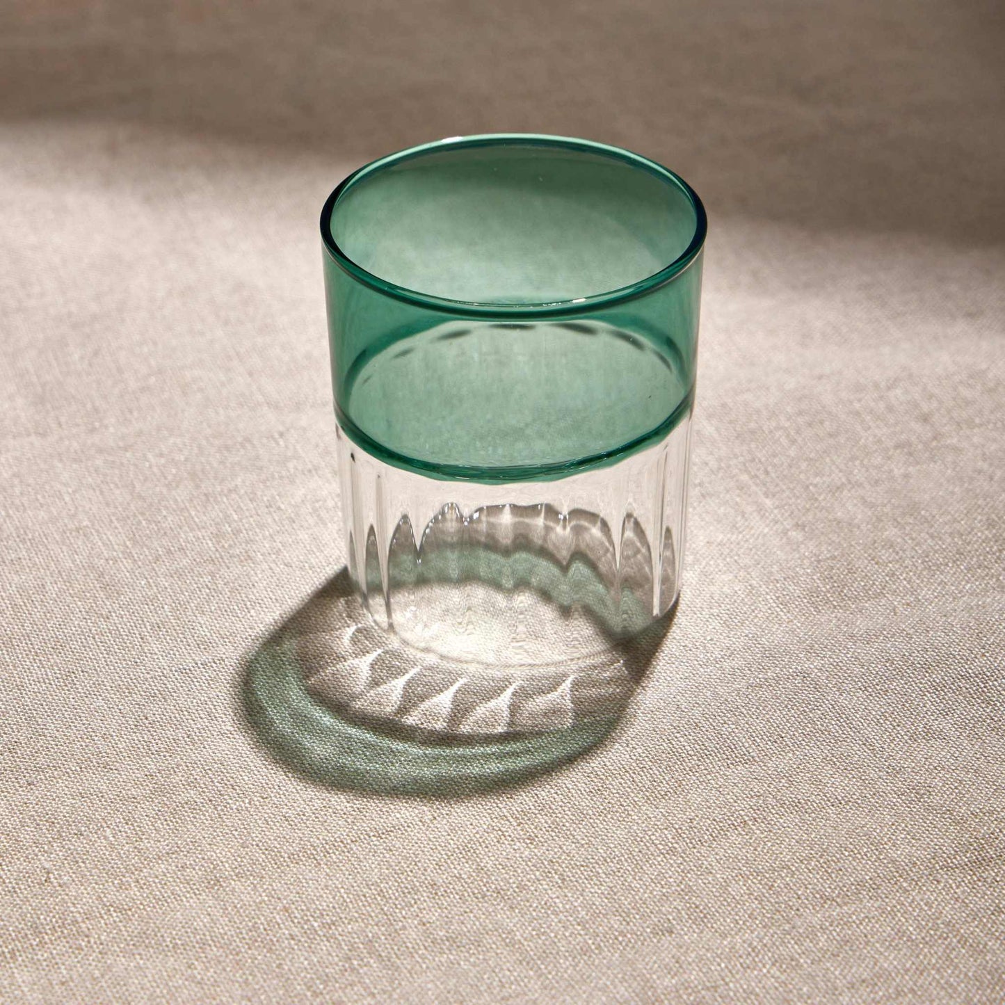 RIPPLES GLASS - GREENAdd a touch of elegance to your drinkware collection with the 200ml Green Ripples Glass Tumbler. Featuring a stunning rippled texture and warm amber hue, it’s perfecGlass