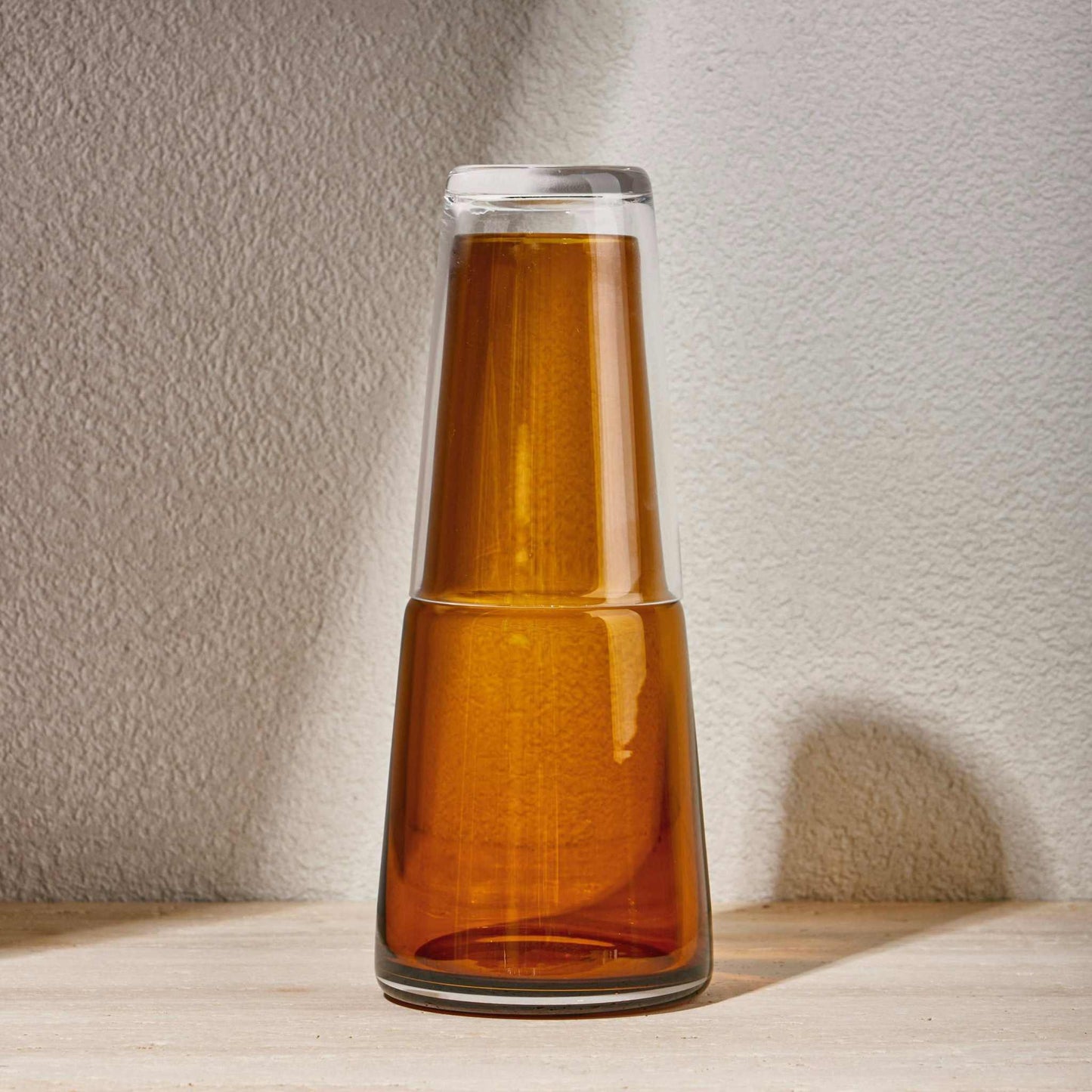 NIGHT WATER SET 750 ML - AMBERElevate your bedside or tabletop with the Amber Night Water Set in a captivating turquoise hue. Designed for both style and function, this sophisticated set includesBottle