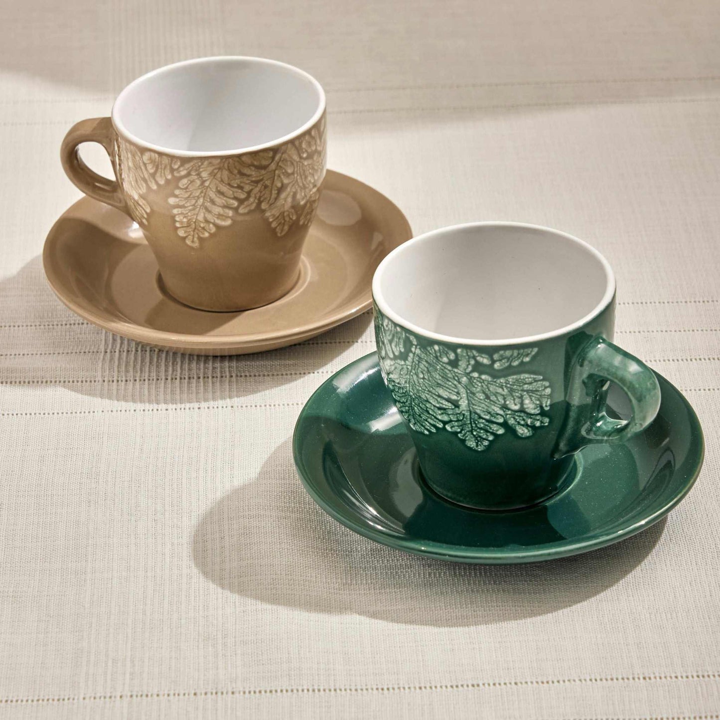 Rila Stoneware Set of 2 tea cups in beige and green with textured leaf design.