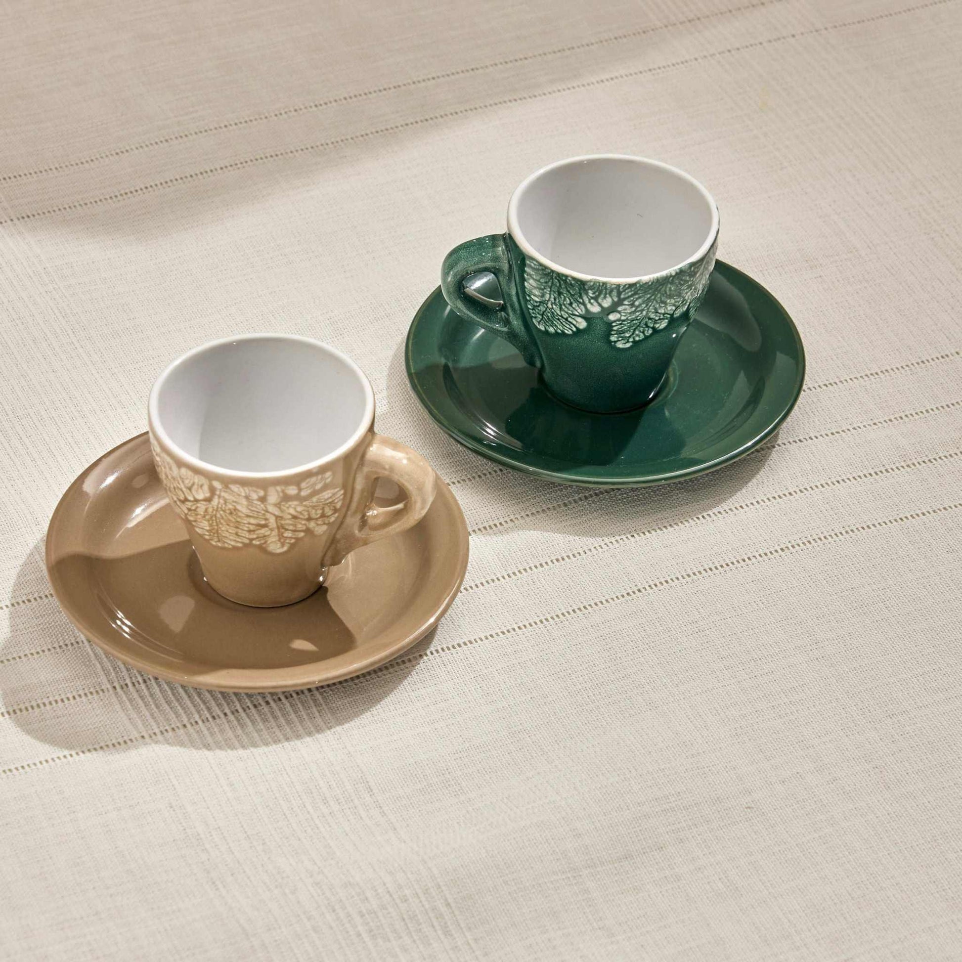 RILA STONEWARE SET OF 2 COFFEE CUPS 100 ML BEIGE - GREENElevate your tea moments with the Rila Stoneware Tea Cup Set, featuring a beautifully textured leaf design and a sophisticated color palette of beige and green. CrafCUP AND SAUCER