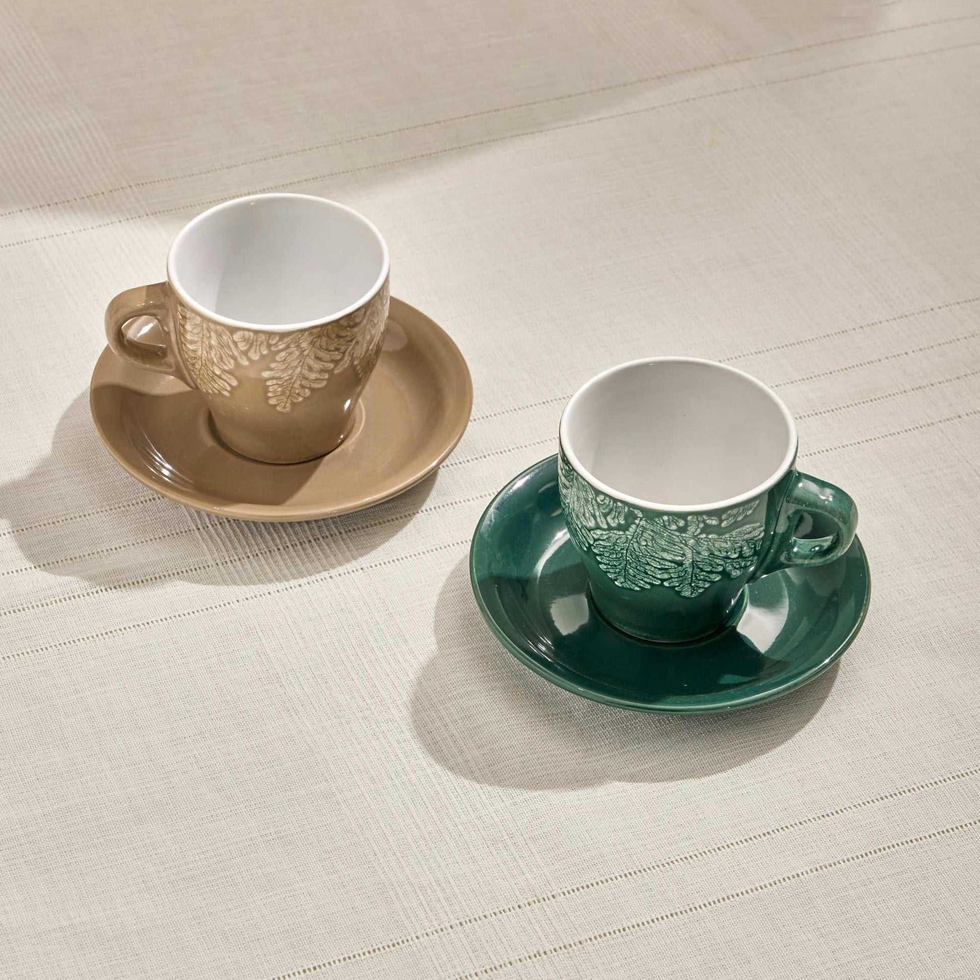 RILA STONEWARE SET OF 2 COFFEE CUPS 100 ML BEIGE - GREENElevate your tea moments with the Rila Stoneware Tea Cup Set, featuring a beautifully textured leaf design and a sophisticated color palette of beige and green. CrafCUP AND SAUCER