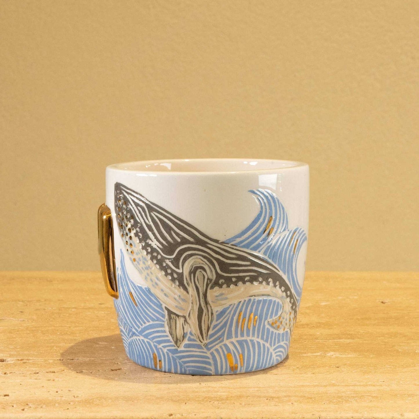 Handmade ceramic mug with gold-plated "SH" letters and floral design.
