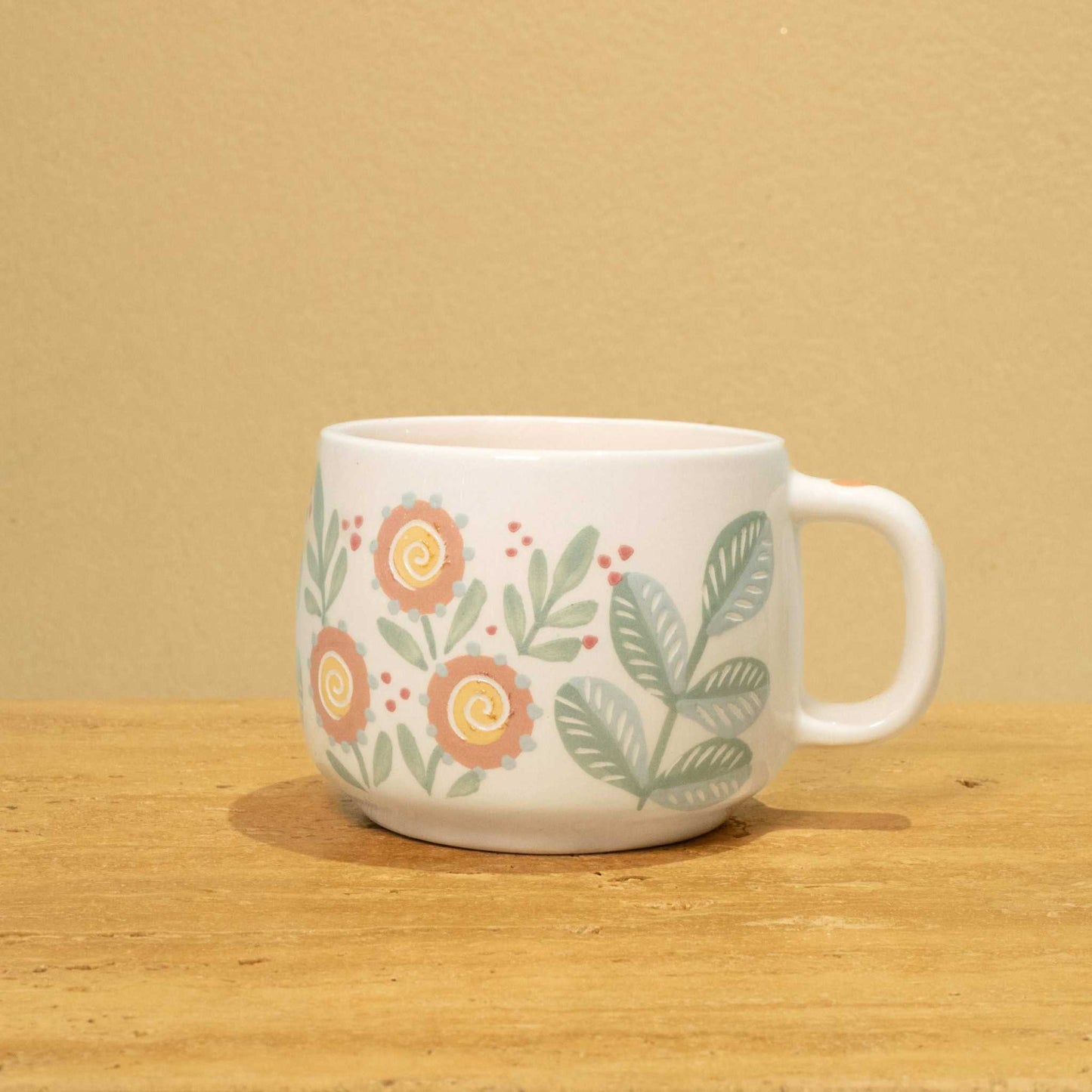 Personalized gold Arabic monogram ceramic mug with floral design, "Best Son in the World" theme.