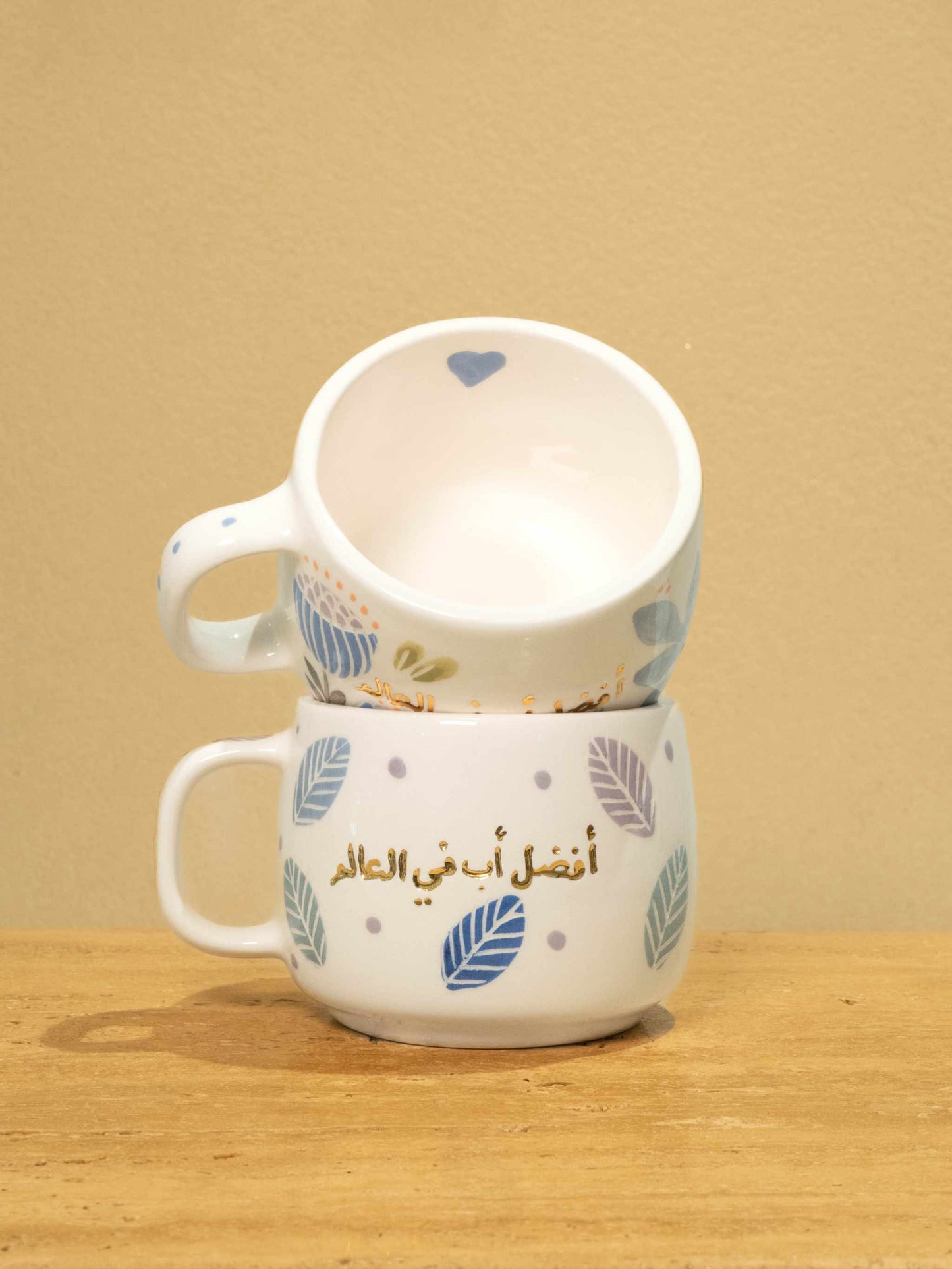 Best Dad in the World personalized gold Arabic monogram ceramic mug with floral design.
