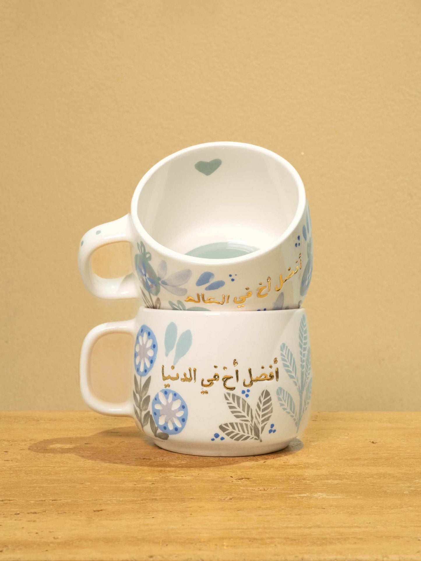 Best Brother in the World gold monogram ceramic mug with floral design.