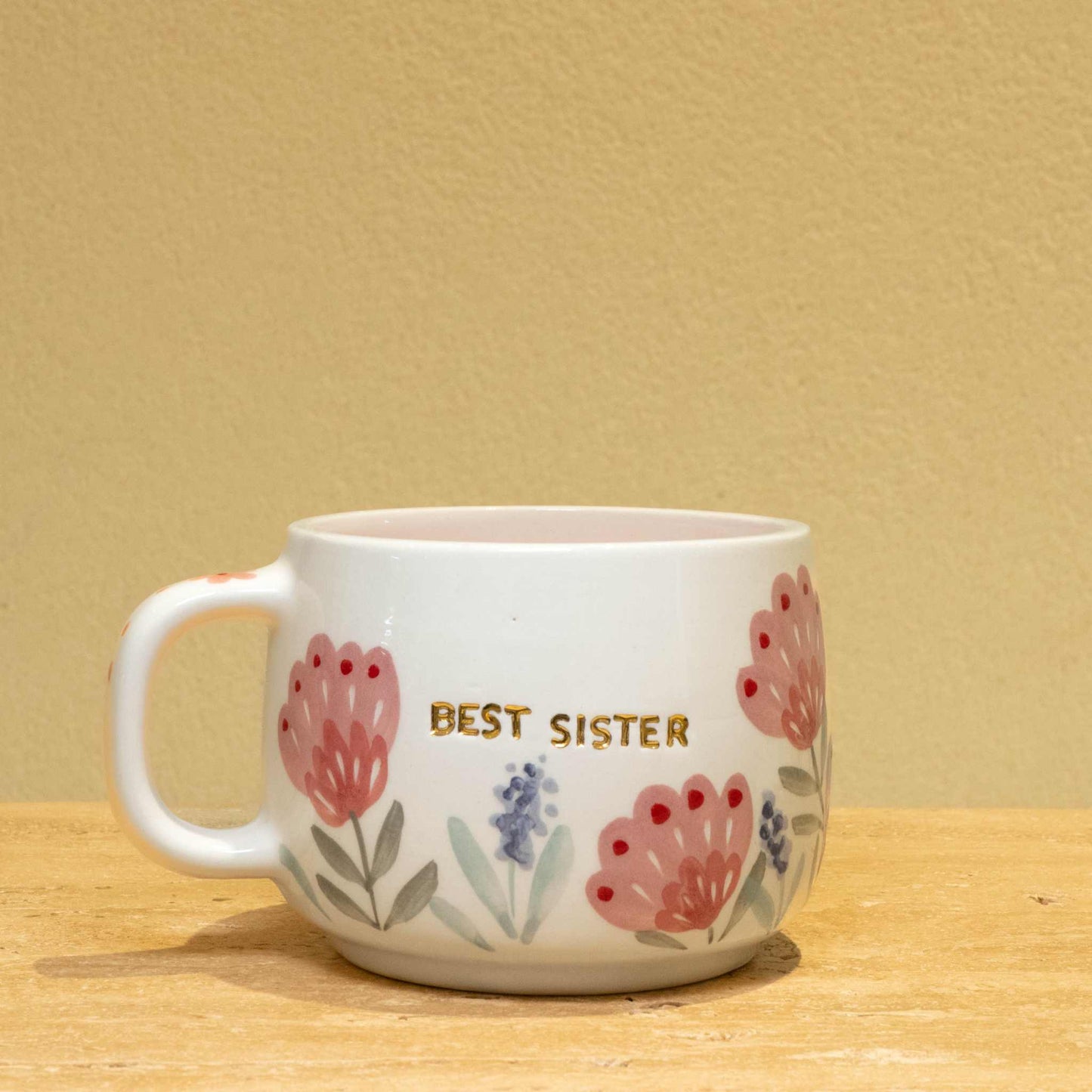 Handmade gold plated cup with "Best Sister" message and floral design.