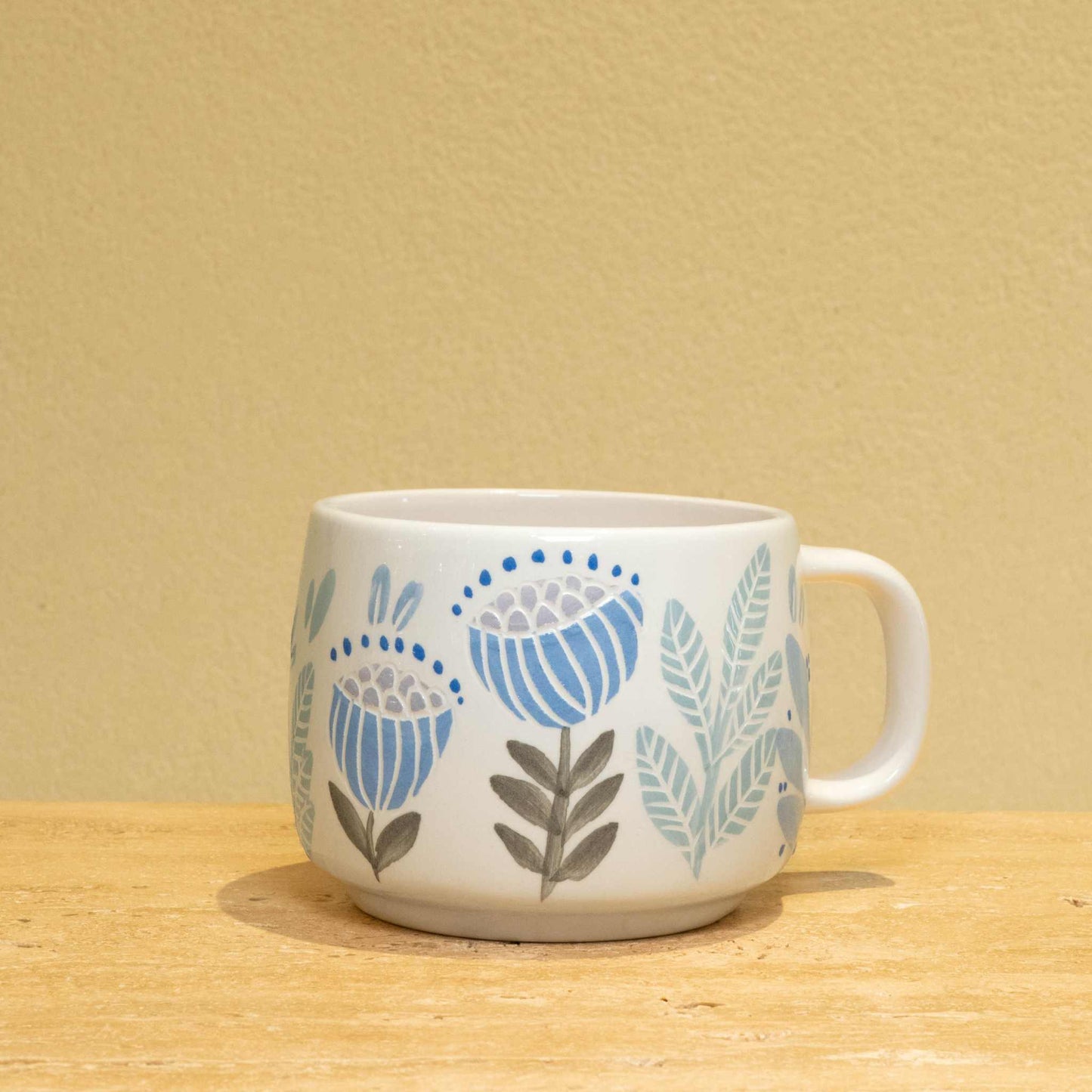 Best Son Ever personalized ceramic mug with gold monogram and floral design.