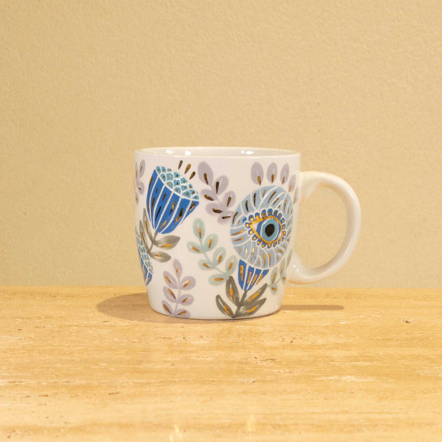 Custom handmade ceramic mug with gold-plated initial "G" and floral design.
