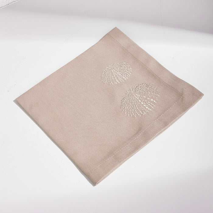 Sea Urchin-Beta Beige placemat and napkin set with embroidered sea urchin design.
