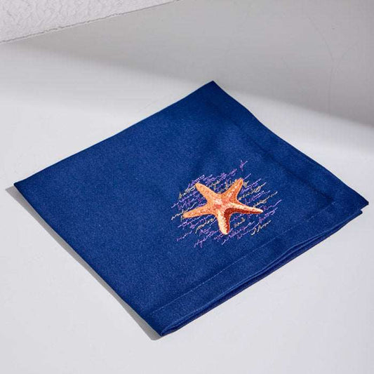 STARFISH POEM-BETA NAVY placemat and napkin set with embroidered starfish design.