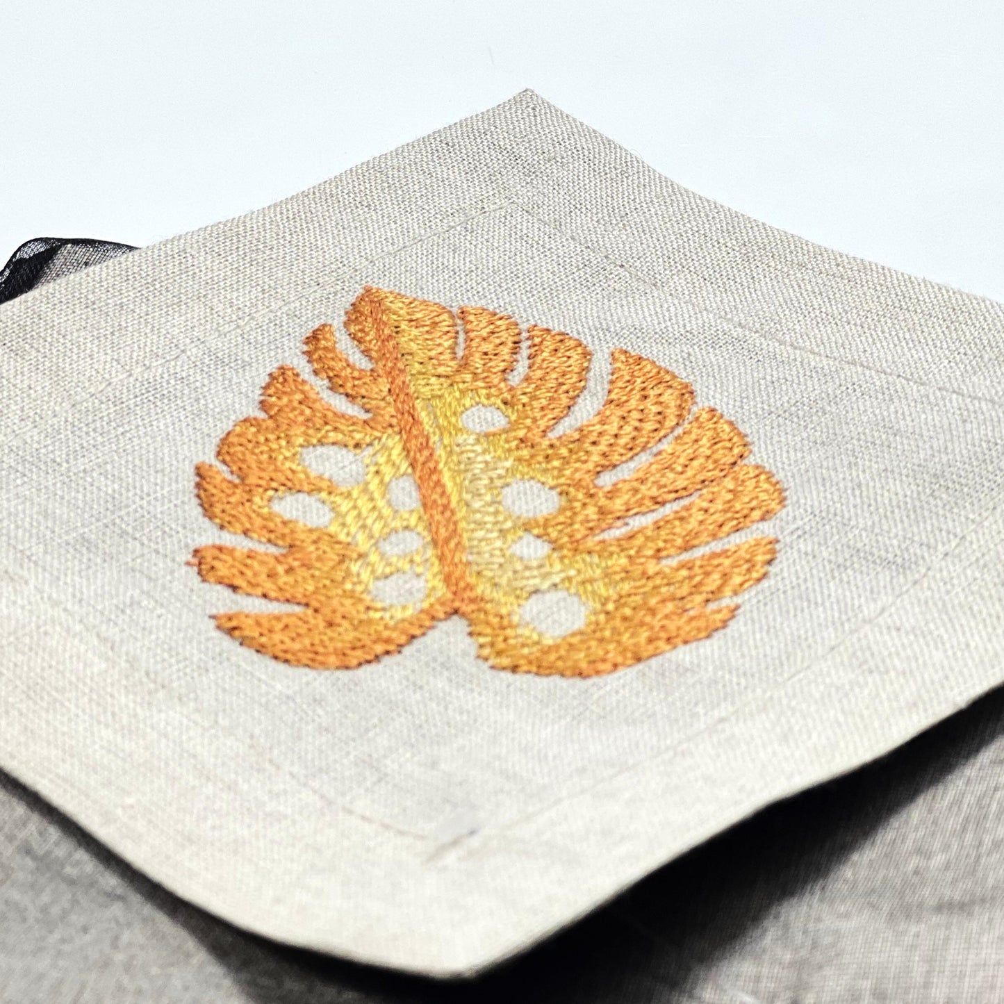 TROPICAL LEAVES-ORANGN NATUREL LINEN COASTER 12*12