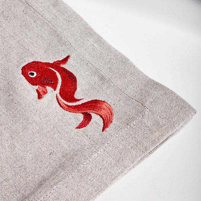 Gold Fish Placemat Napkin with detailed embroidery, perfect for enhancing your dining table.