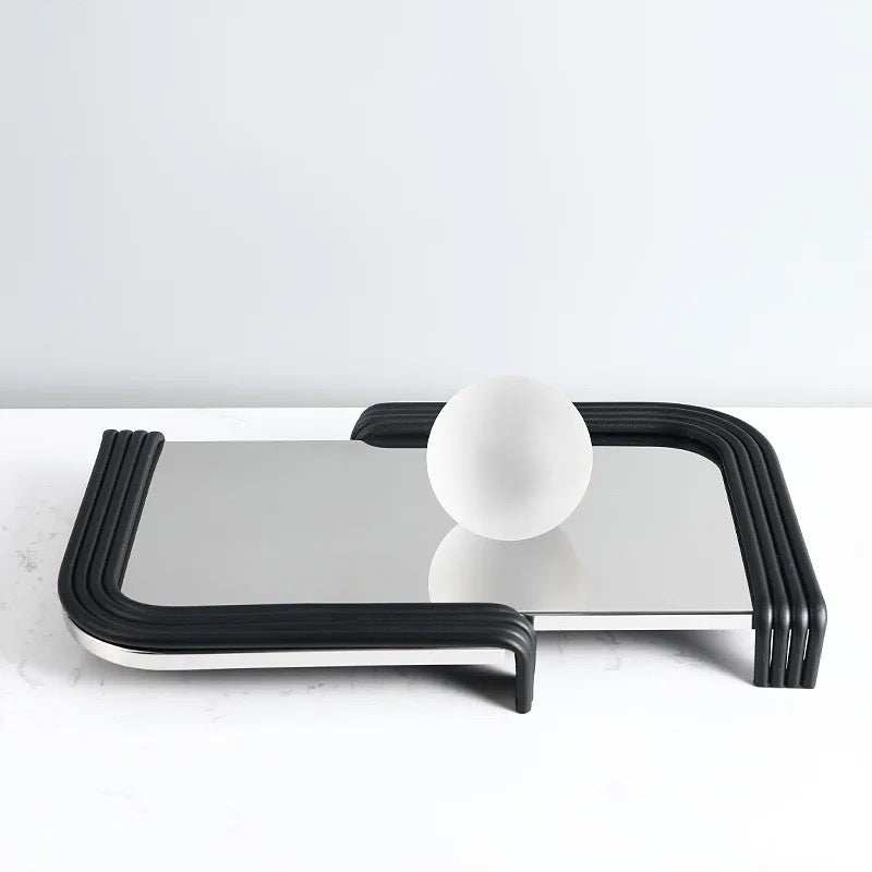 AIM TRY tray with a polished reflective surface and black curved edges.