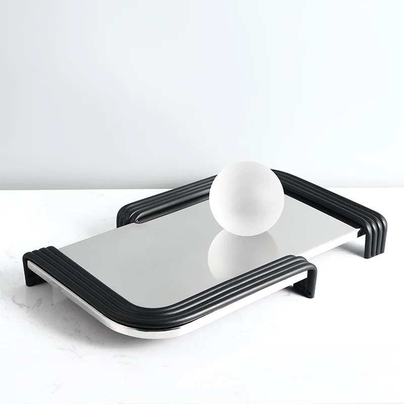 AIM TRY tray with reflective surface and black curved edges on display.