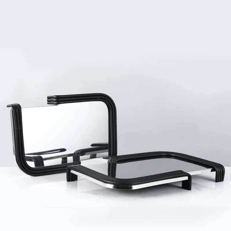 Sleek AIM TRY tray with reflective surface and black curved edges for stylish décor.