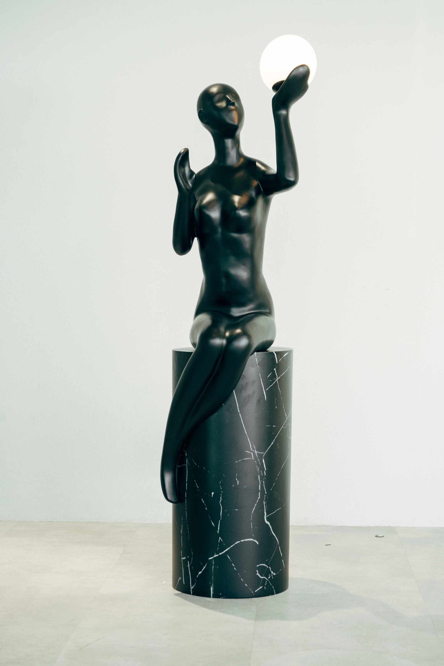 The Globe Sculptural Floor Lamp - BlackElevate your home decor with this stunning sculptural floor lamp, a blend of art and functionality. Made from premium-quality fibre, this sleek, matte black abstractFloor Lamp