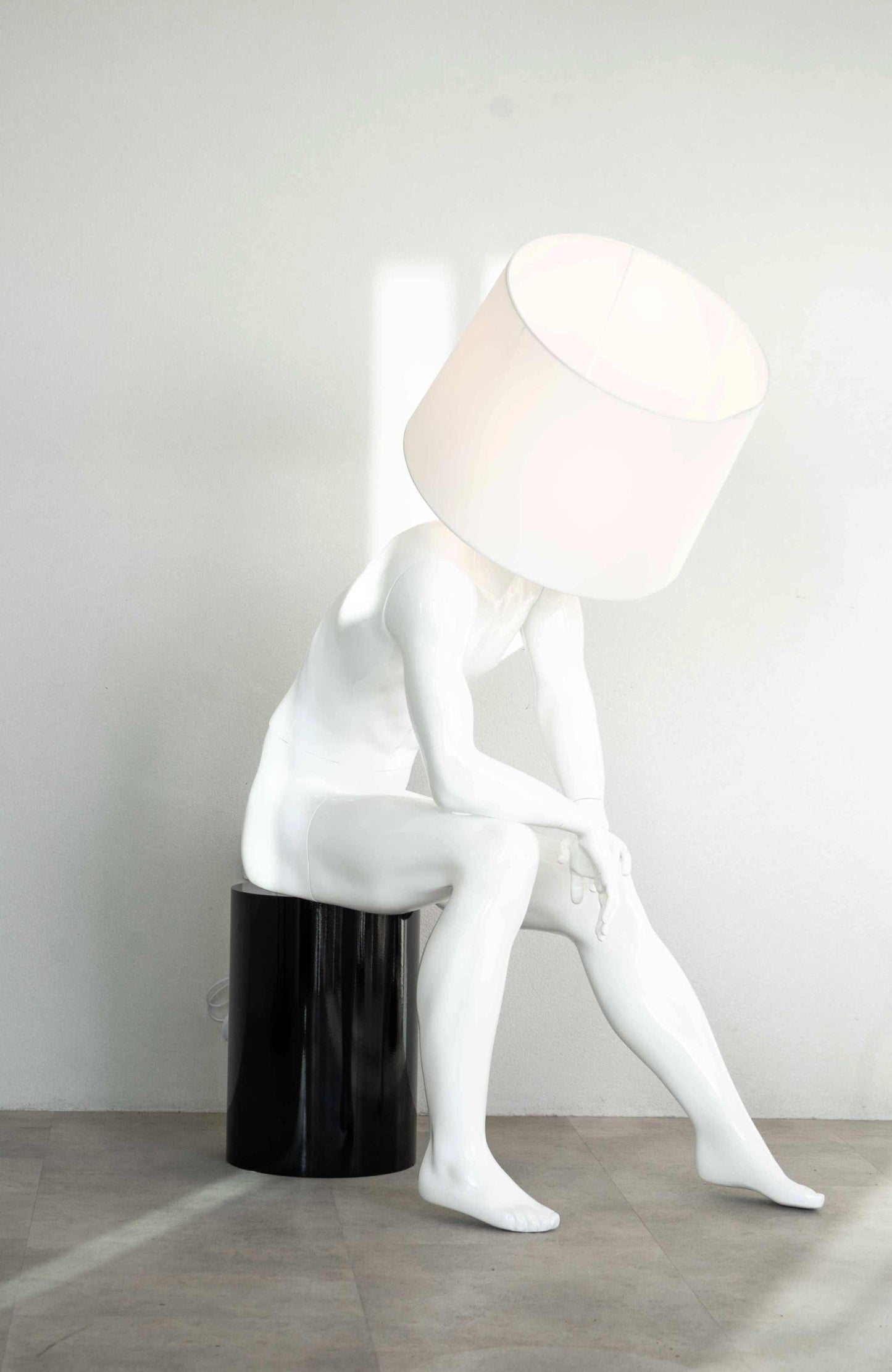 Sitting Man Sculptural Floor Lamp - WhiteElevate your home decor with this stunning sculptural floor lamp, a blend of art and functionality. Made from premium-quality fibre, this sleek, matte black abstractFloor Lamp