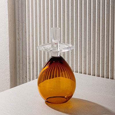 Princess Samdan Amber Candle Holder with amber glass base and transparent top, perfect for home décor.