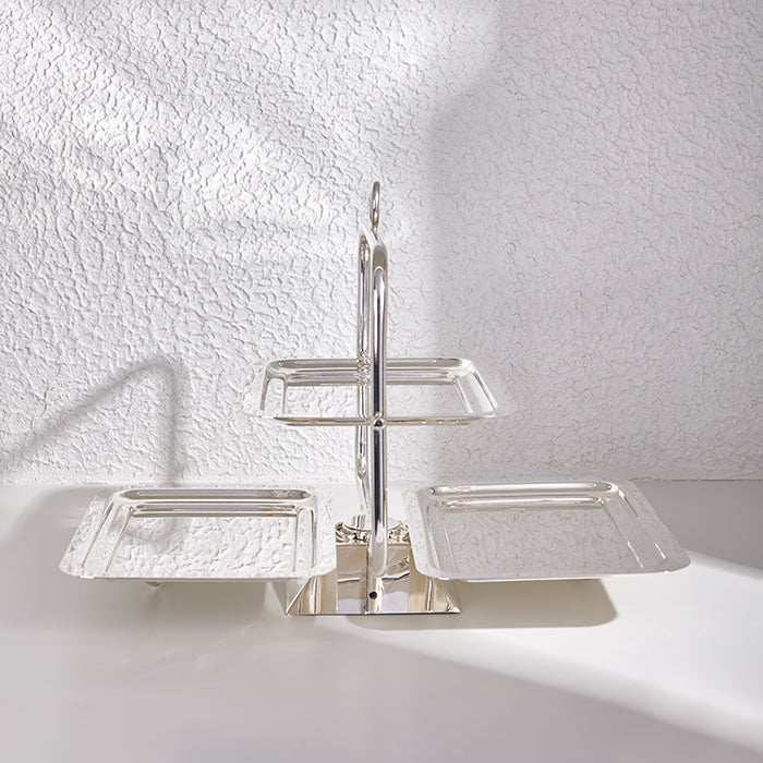 Silver square serving tray with butterfly-inspired design.