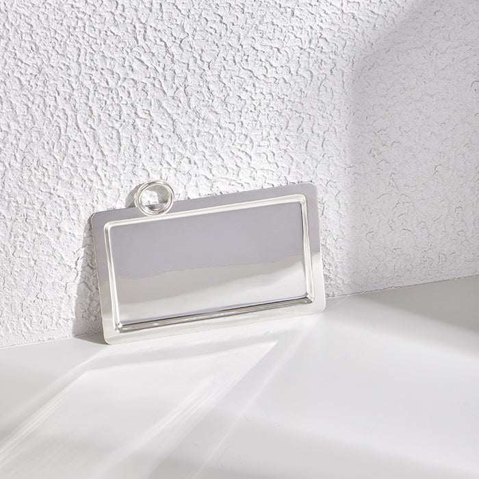 Silver tray with ring handle, 23x31cm, sleek polished metal design.