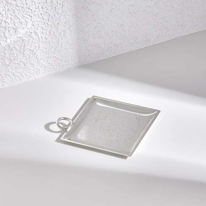 Silver tray with ring handle, 15x15cm, high-quality silver-plated metal, minimalist design.