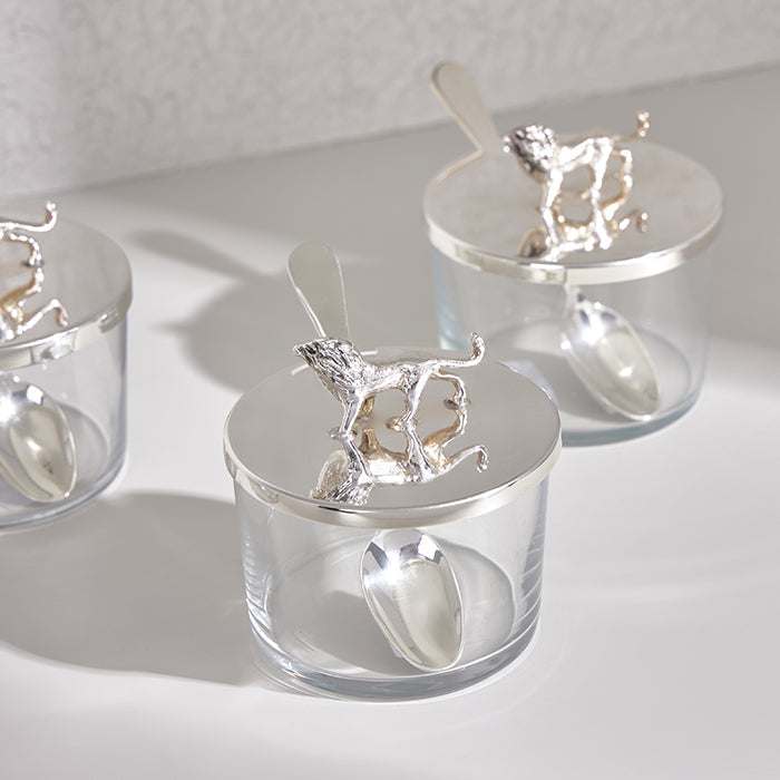 Elegant Leon Mini Canister with silver-plated lid and lion figurine.