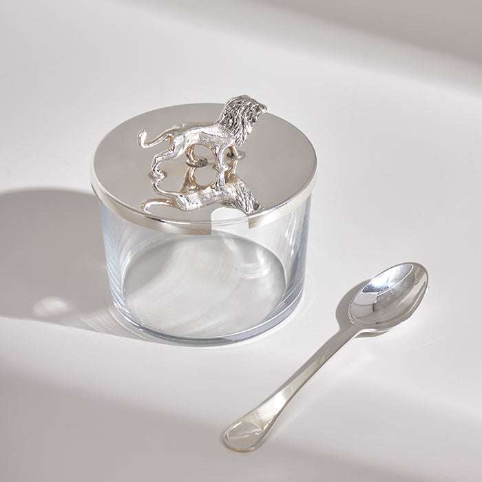 LEON MINI CONASTER in silver with lid featuring a lion figurine, an elegant kitchen accessory.