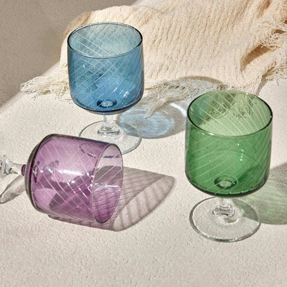 LAL WINE GLASS - PURPLE Elevate your table setting with this elegant purple wine glass, featuring a modern diagonal stripe design and a sleek, clear stem. Perfect for serving wine, cocktailGlass