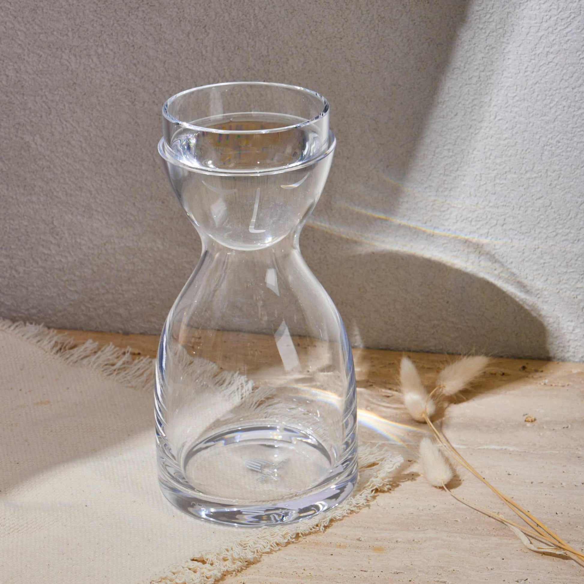 NUDE GLASS WATER SET CLEAR 850 MLElevate your drinkware collection with the  Nude Night Bottle Set. This bottle set is perfect for holding your favorite beverages, whether it's water, juice, or a reBottle