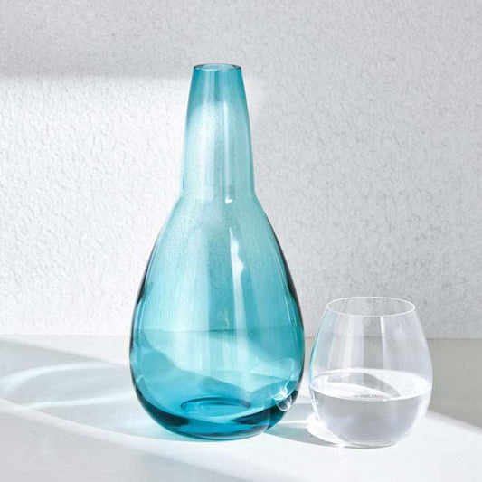 NUDE NIGHT WATER SET  1.5L - TURQUOISEElevate your bedside or tabletop with the NUDE Night Water Set in a captivating turquoise hue. Designed for both style and function, this sophisticated set includes Bottle