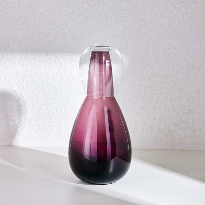 NUDE NIGHT WATER SET 1.5 Litre - VIOLETElevate your bedside or tabletop with the NUDE Night Water Set in a captivating Violet. Designed for both style and function, this sophisticated set includes a beautBottle