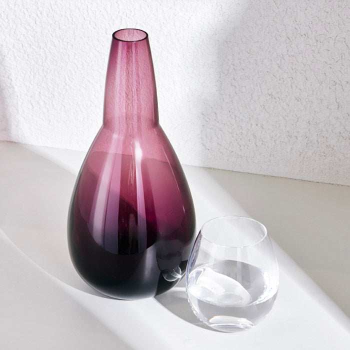 NUDE NIGHT WATER SET 1.5 Litre - VIOLETElevate your bedside or tabletop with the NUDE Night Water Set in a captivating Violet. Designed for both style and function, this sophisticated set includes a beautBottle