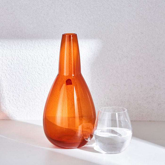 NUDE NIGHT WATER SET 1.5 Litre - AMBERElevate your bedside or tabletop with the NUDE Night Water Set in a warm and elegant amber hue. Designed for both style and function, this sophisticated set includesBottle