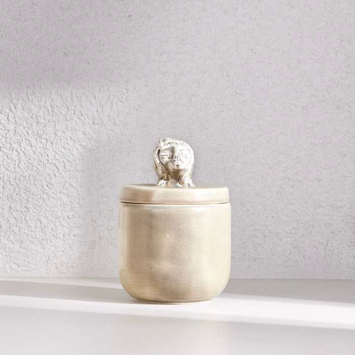 HANDMADE SLEEPING GIRL CERAMIC JAR - STOON GOLDAdd a touch of artistry and elegance to your space with the Handmade Sleeping Girl Ceramic Jar in a stunning Stoon Gold finish. This beautifully crafted piece featurCeramic Jar