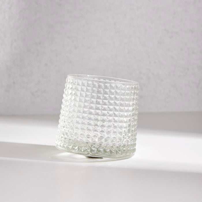 Revolving Whiskey Glass with Textured Design on Tilted Base