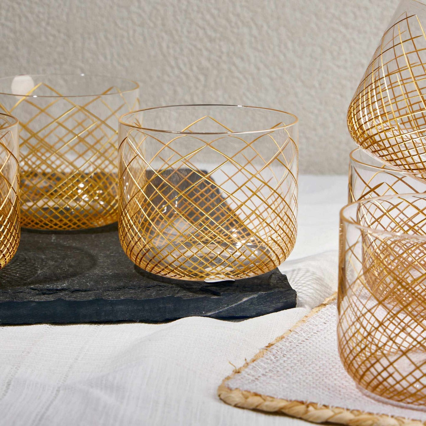 OMNIA GOLD GLASS SET OF 6Experience the charm of the OMNIA GOLD GLASS, a perfect blend of elegance and practicality. Crafted from premium-quality transparent glass with gold strips this cup Glass