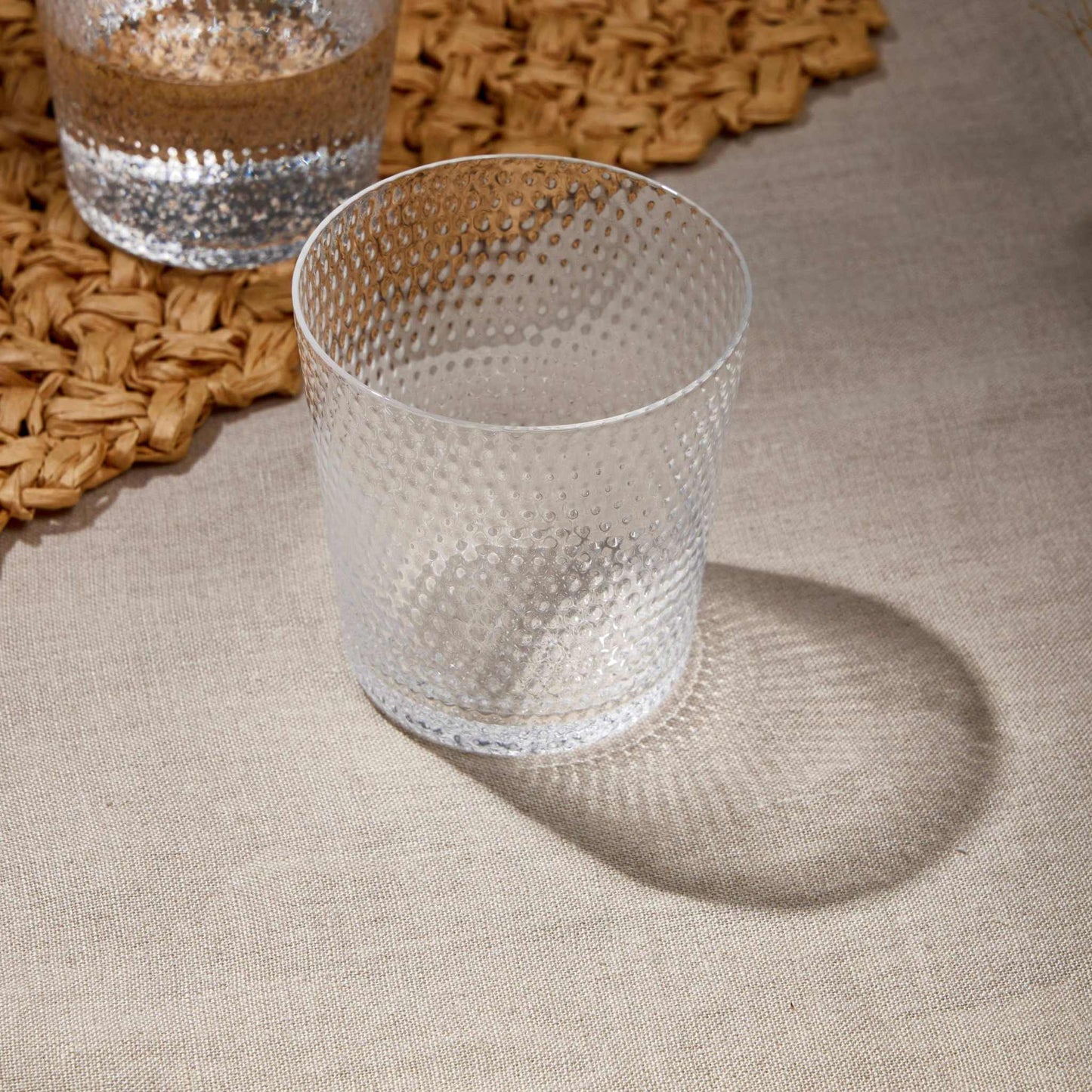 Whiskey Glass 380 ml with textured design on woven placemat, ideal for whiskey, bourbon, scotch, and cocktails.