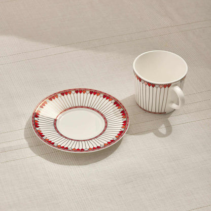 HEARTS PORCELAIN TEA CUP - REDAdd a touch of elegance to your tea time with this beautifully crafted porcelain tea cup and saucer set. Featuring a captivating red and white design with delicate hCUP AND SAUCER