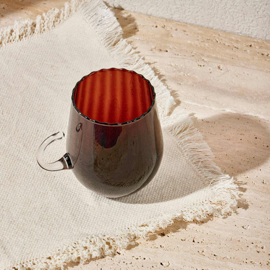 Optical Cup Light Caramel glass mug with gradient and rippled texture.
