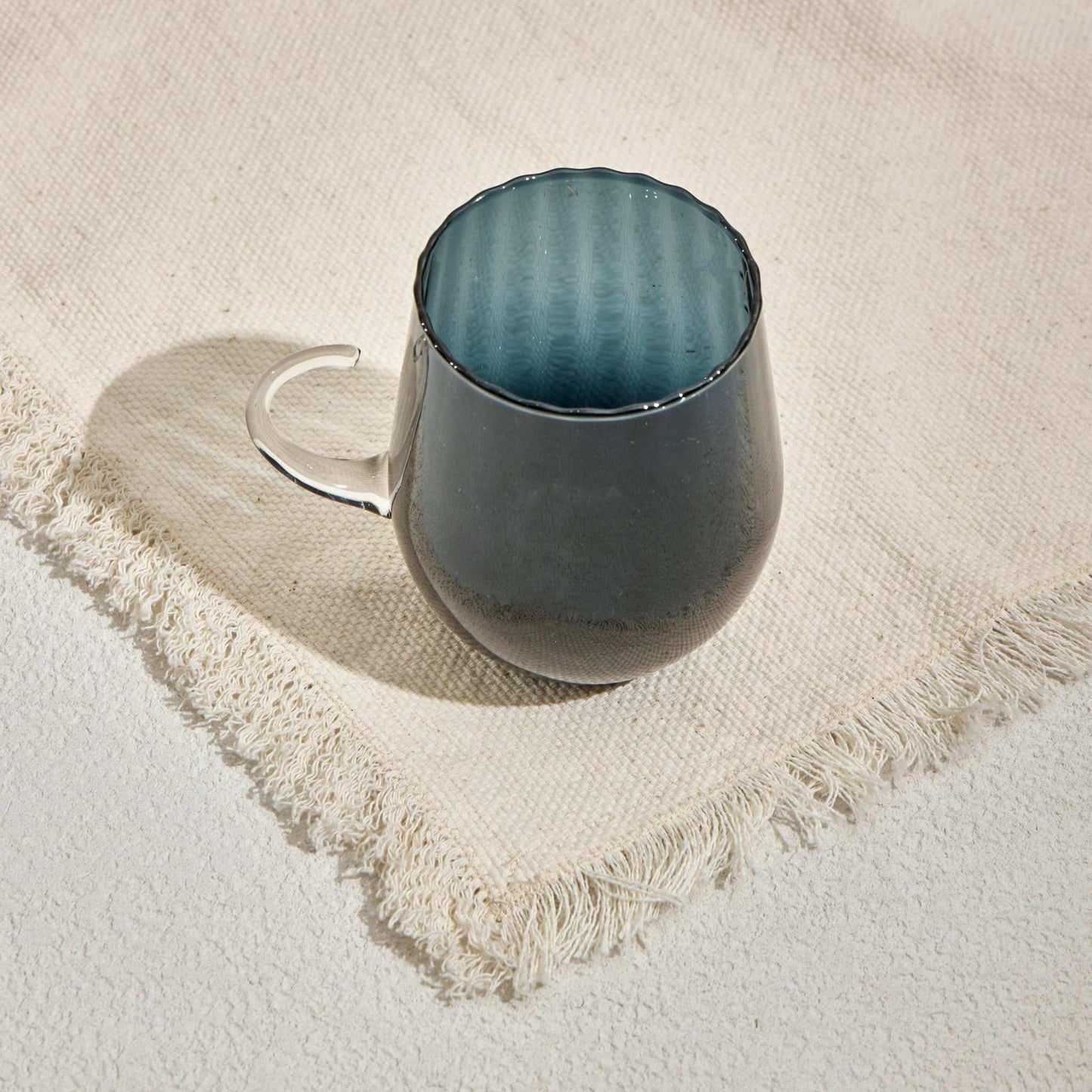 OPTICAL CUP - NAVYUpgrade your drinkware collection with the Optical Cup Navy, a stunning gradient glass mug designed for those who appreciate elegance and sophistication. Featuring aGlass Mug