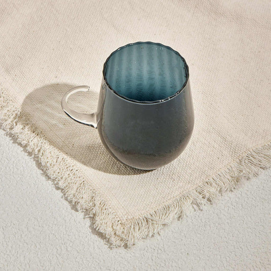 OPTICAL CUP - NAVYUpgrade your drinkware collection with the Optical Cup Navy, a stunning gradient glass mug designed for those who appreciate elegance and sophistication. Featuring aGlass Mug