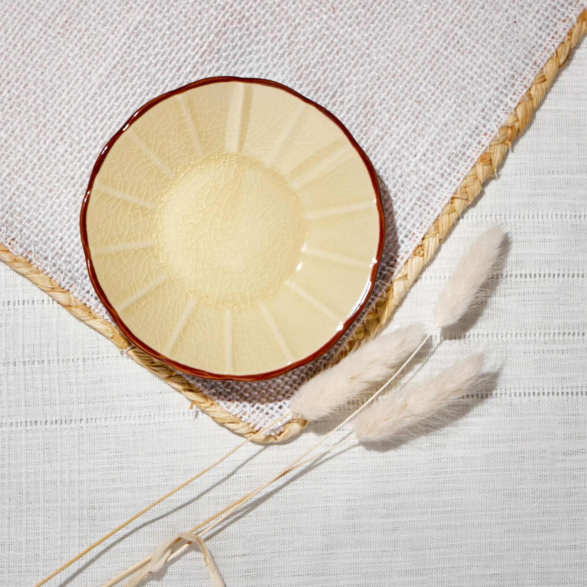 ACEM CERAMIC TEA PLATE- CARAMELElevate your tea-time experience with the ACEM Ceramic Tea Plate in a warm caramel hue. This elegant plate features a minimalist sunburst design with a textured centCeramic Plate