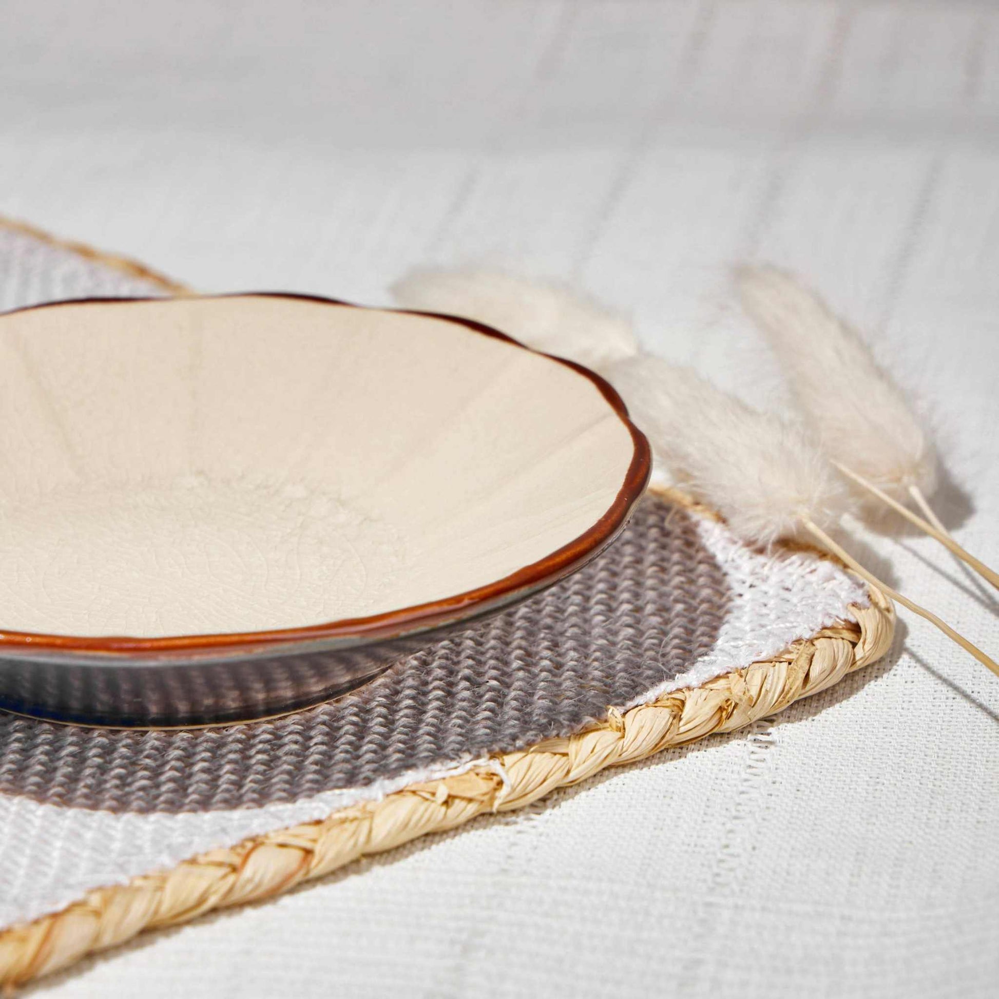 ACEM CERAMIC TEA PLATE- CARAMELElevate your tea-time experience with the ACEM Ceramic Tea Plate in a warm caramel hue. This elegant plate features a minimalist sunburst design with a textured centCeramic Plate