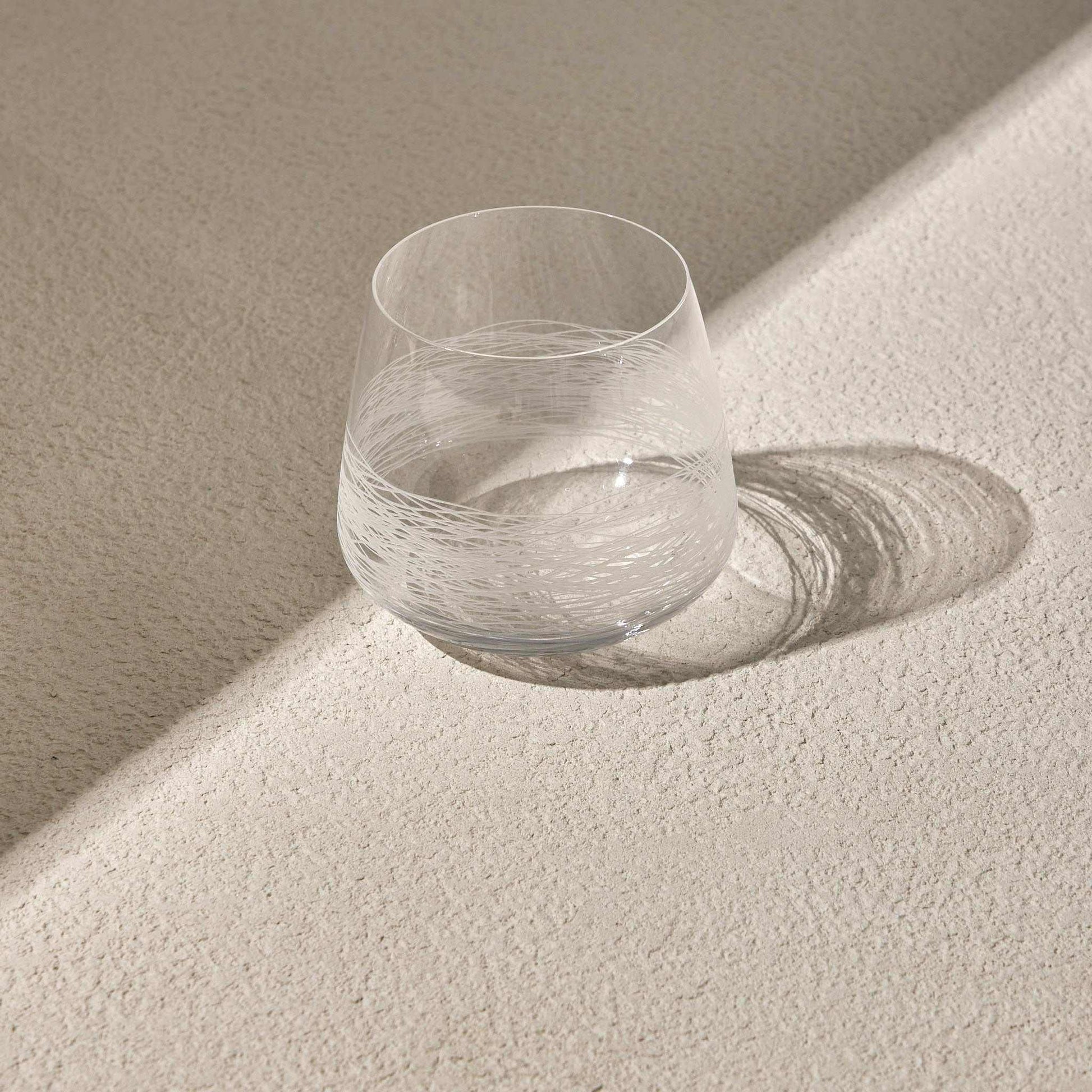 WHISKEY GLASSElevate your drinking experience with our Whisky Glass , the perfect blend of elegance and functionality. Designed with a modern aesthetic, this glass features a strGlass