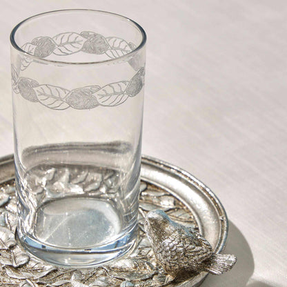 SPARROW - WATER SET SILVERBring elegance to your table with the "Sparrow" Water Set in a timeless silver finish. This exquisite set features a delicately engraved glass and an intricately desCUP AND SAUCER